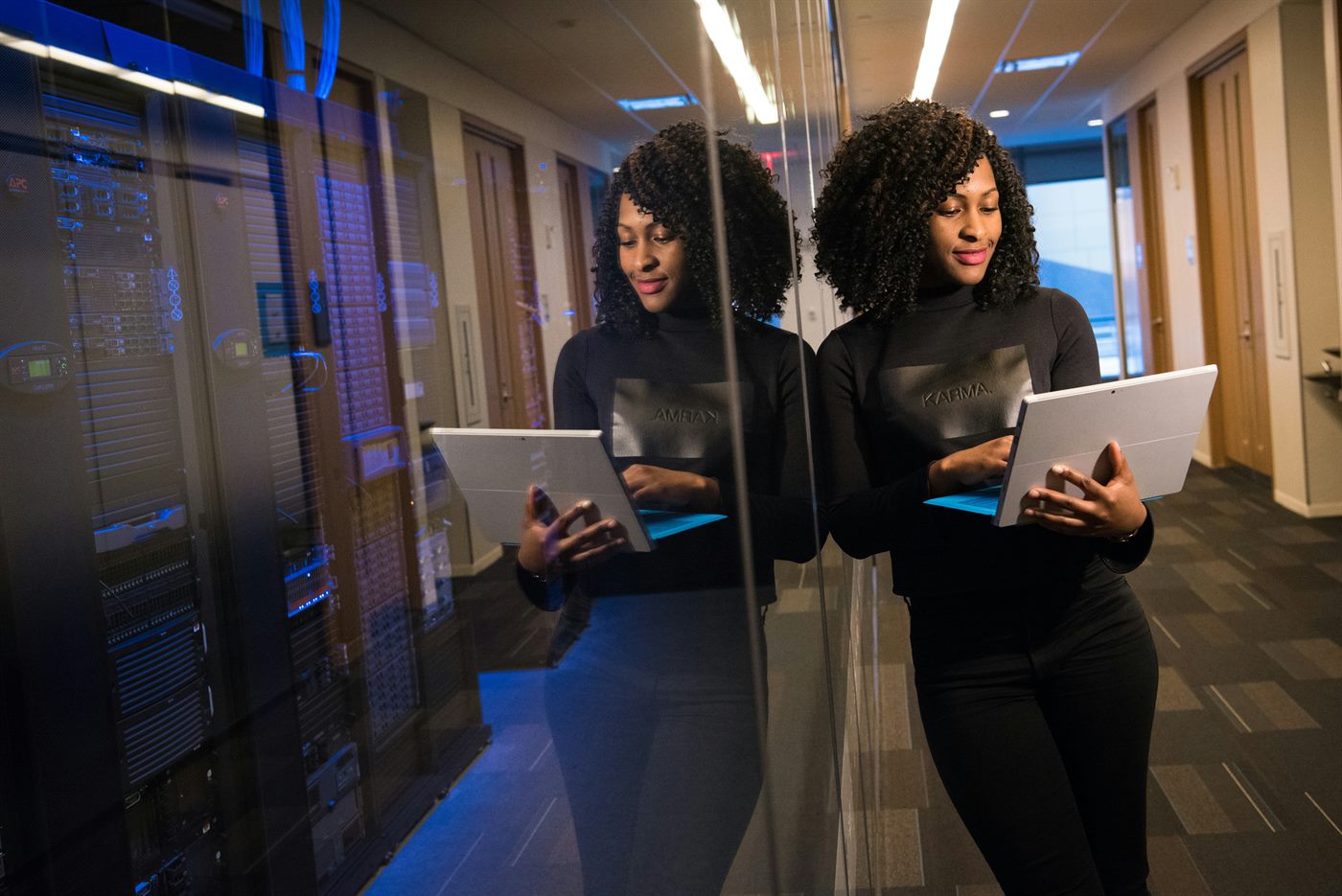 Black woman working in a server room